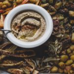 hummus and roasted vegetables on a sheet pan | sultryvegan.com