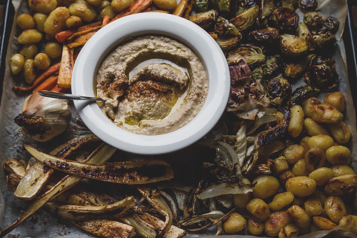 hummus and roasted vegetables on a sheet pan | sultryvegan.com