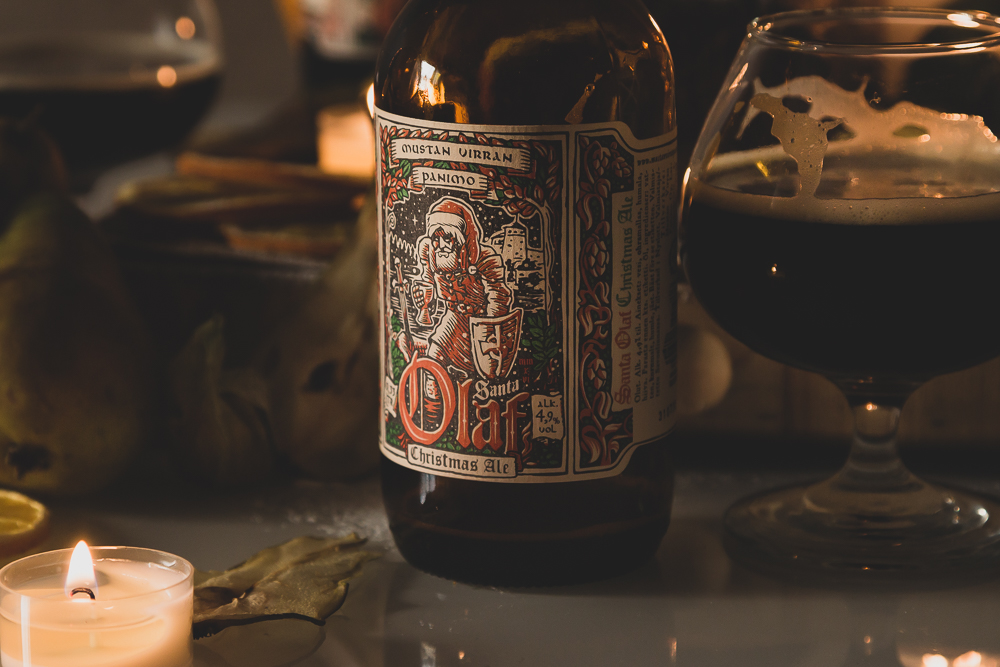 Delicious Christmas craft beer bottle and a glass on a table