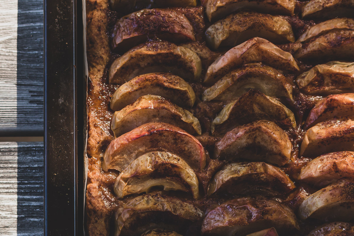 A close up of an apple pie in a shimmering sun light.